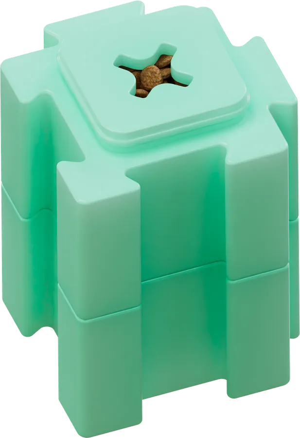 Mint green HERO LinkBlox stacked two blocks tall with a treat visible through the cross-shaped top opening