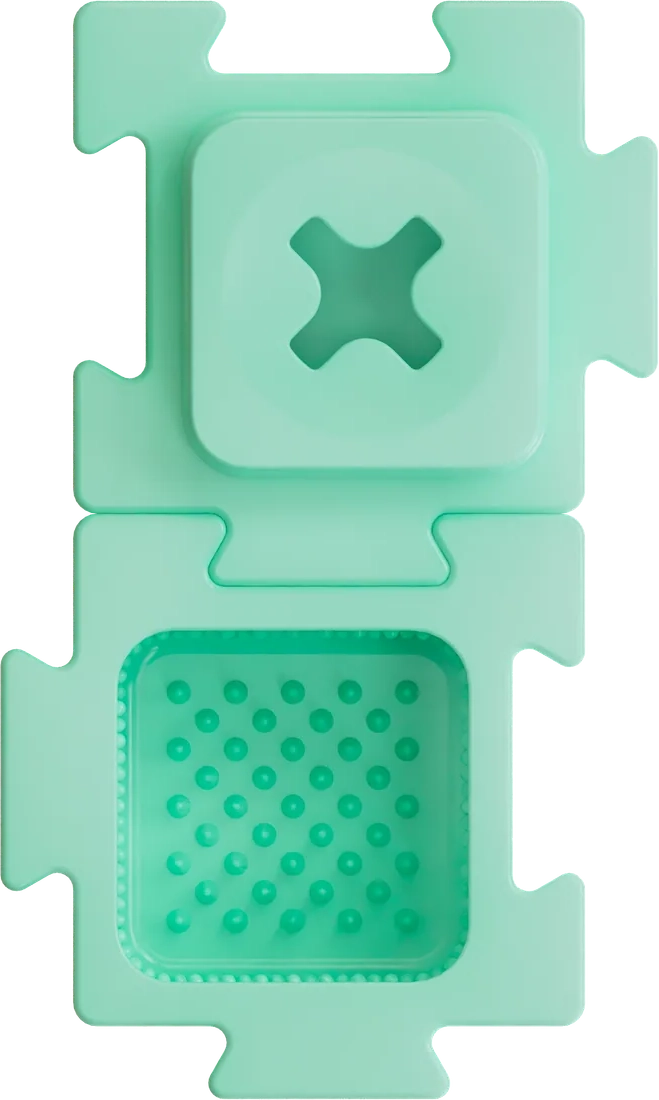 Two teal HERO LinkBlox blocks linked, one with a cross-shaped lid and one with a raised dot foraging chamber